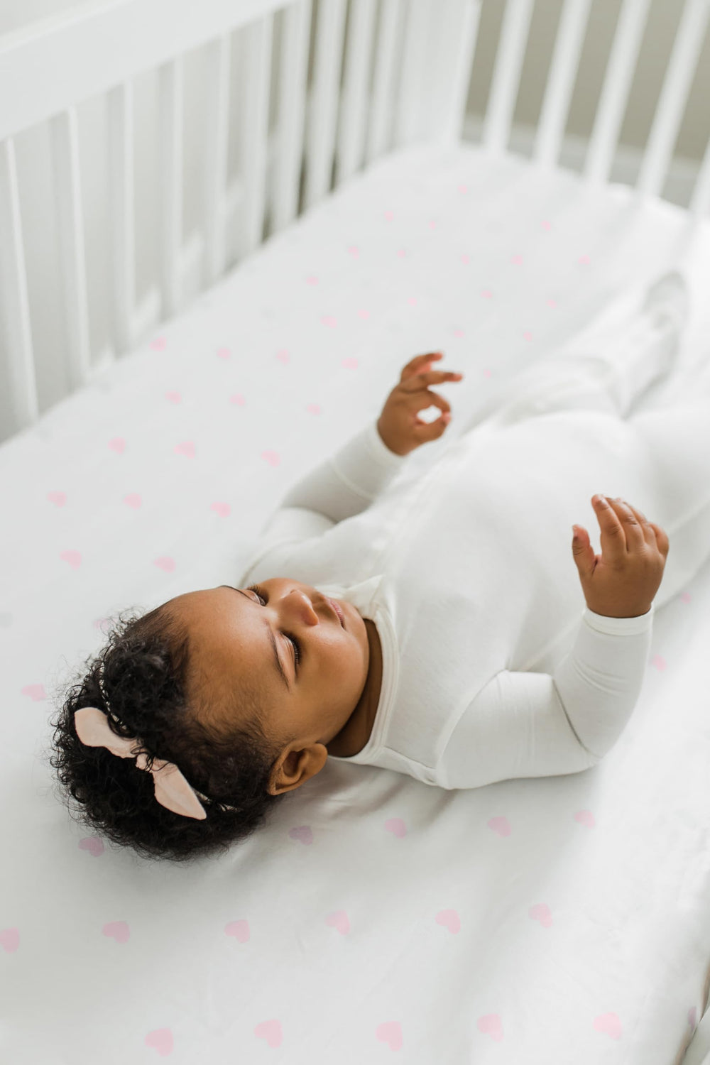 CutieCozy satin crib sheet showcases easy-care, machine-washable fabric.