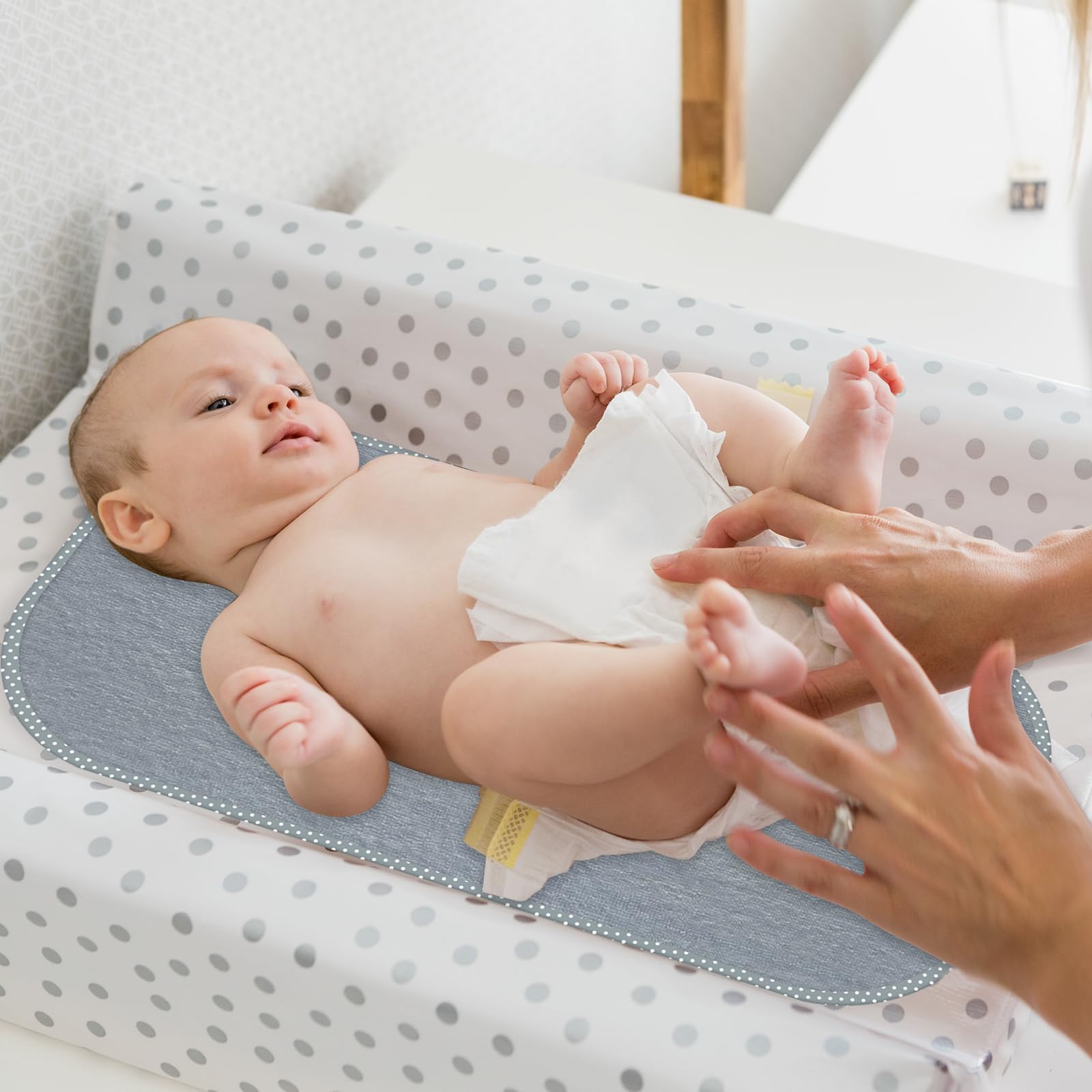 CUXFLS liner in stroller or car seat provides clean, dry changes.