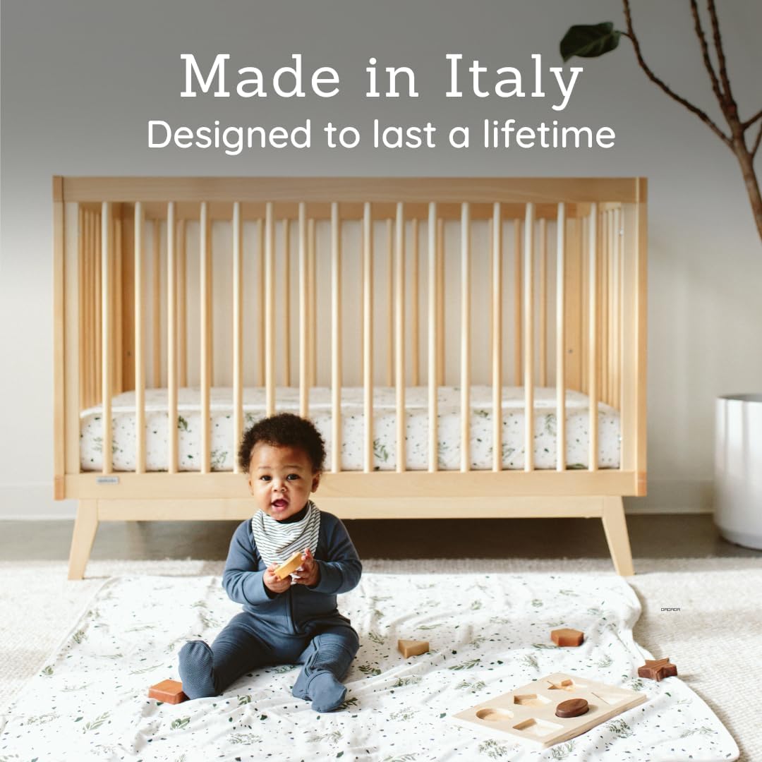 Dadada Soho adjustable-height crib for easy newborn to toddler transitions.