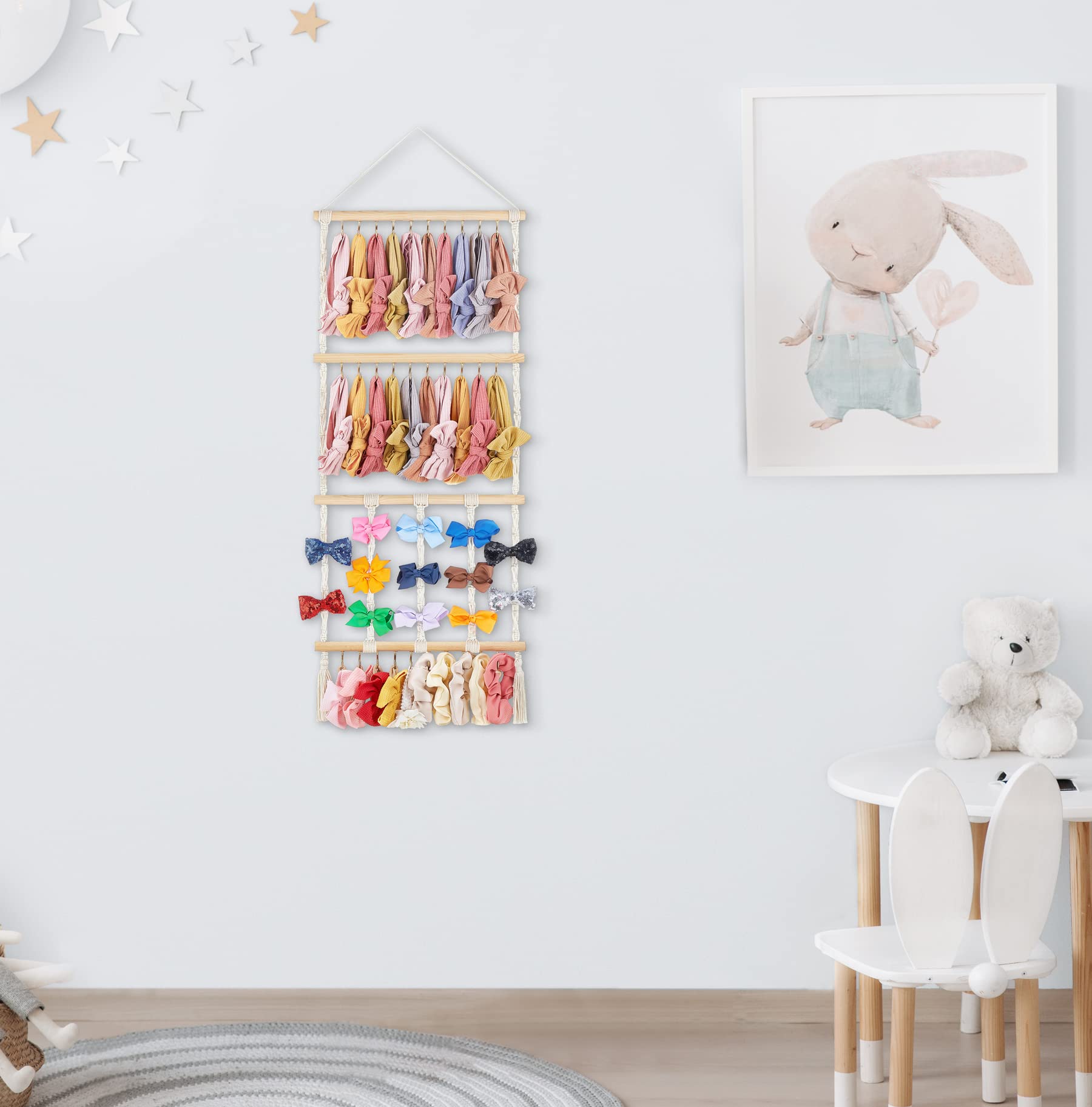 Dahey macrame bow organizer with wooden sticks showcases hair accessories neatly.