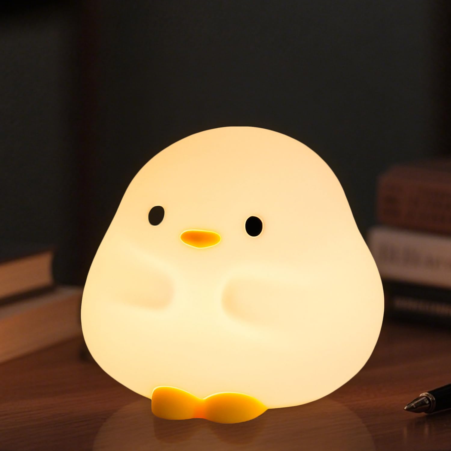 Daixinde DuDu Duck night light on bedside table offers gentle illumination for bedtime routines.