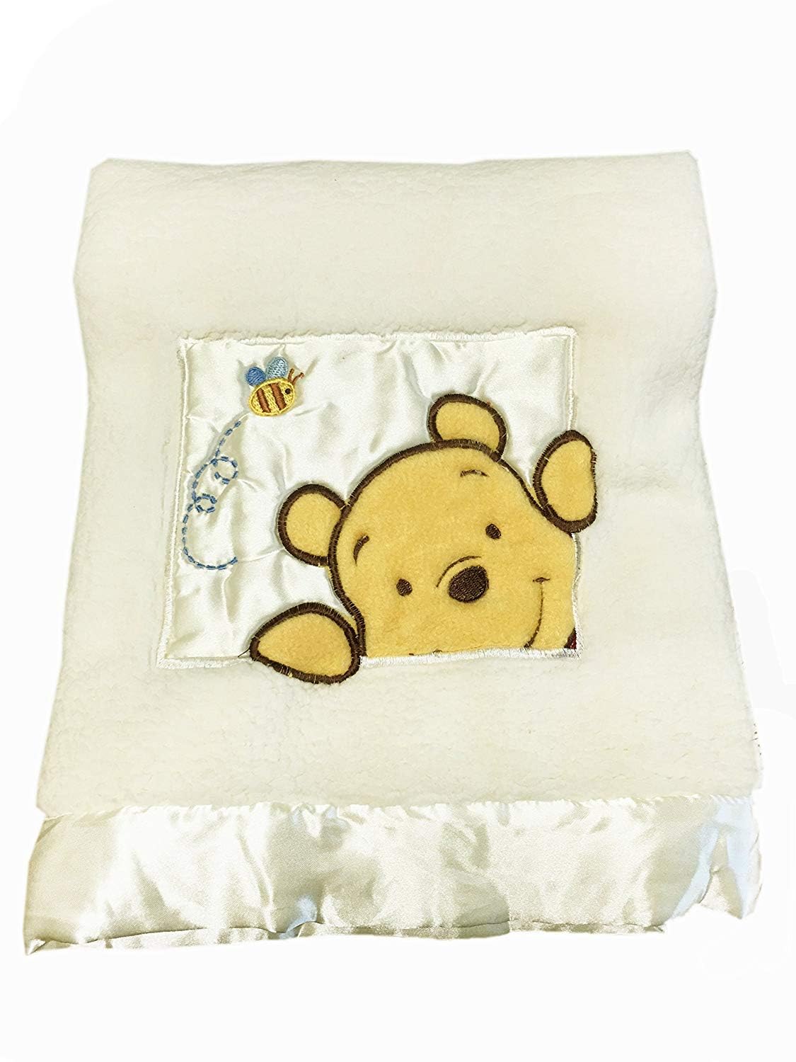 Danica Soft Coral Fleece Blanket Winnie Bear Ivory provides plush warmth for cozy baby snuggles.