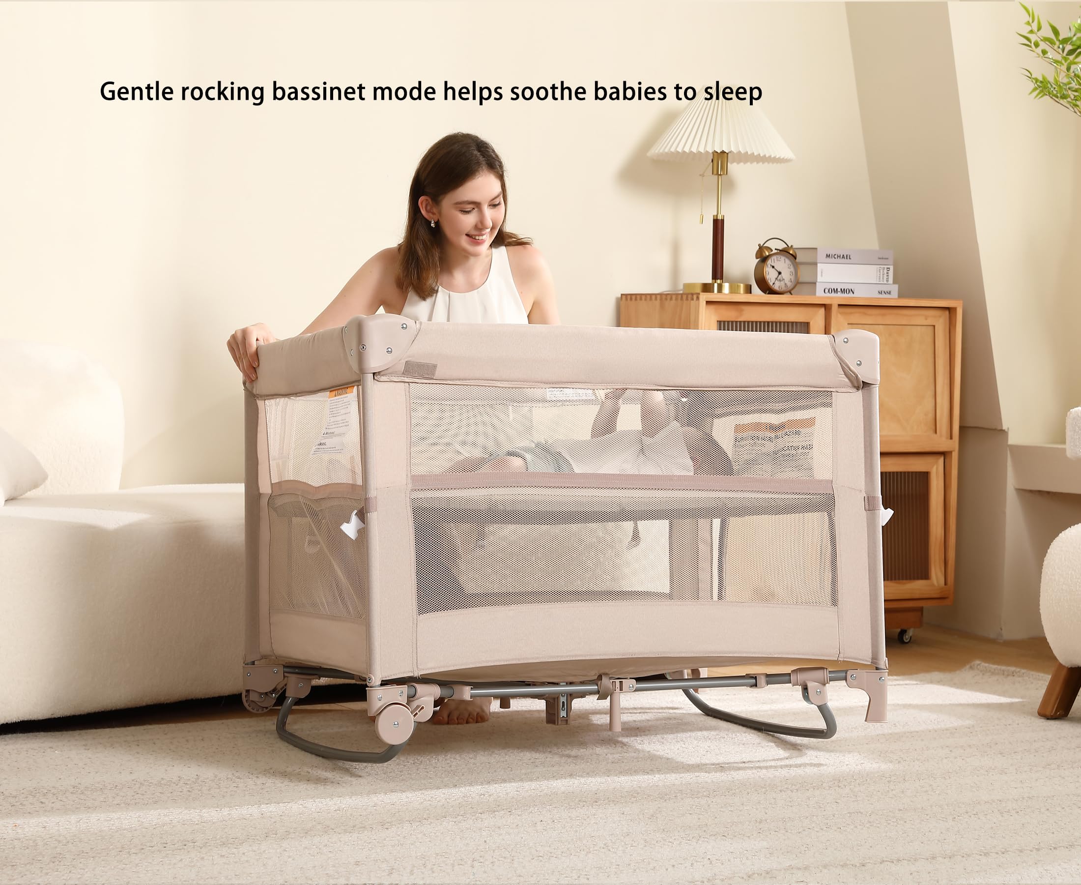 Dapue Pack and Play beige storage tray and music box within reach
