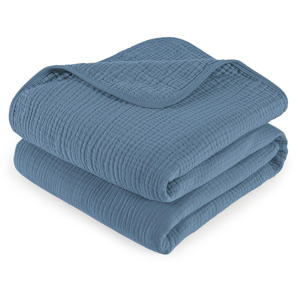 David's Kids baby muslin blanket folded for portability, showcasing soft texture.