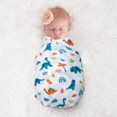 David's Kids dinosaur blue swaddle blanket in pram demonstrates multipurpose daily use.