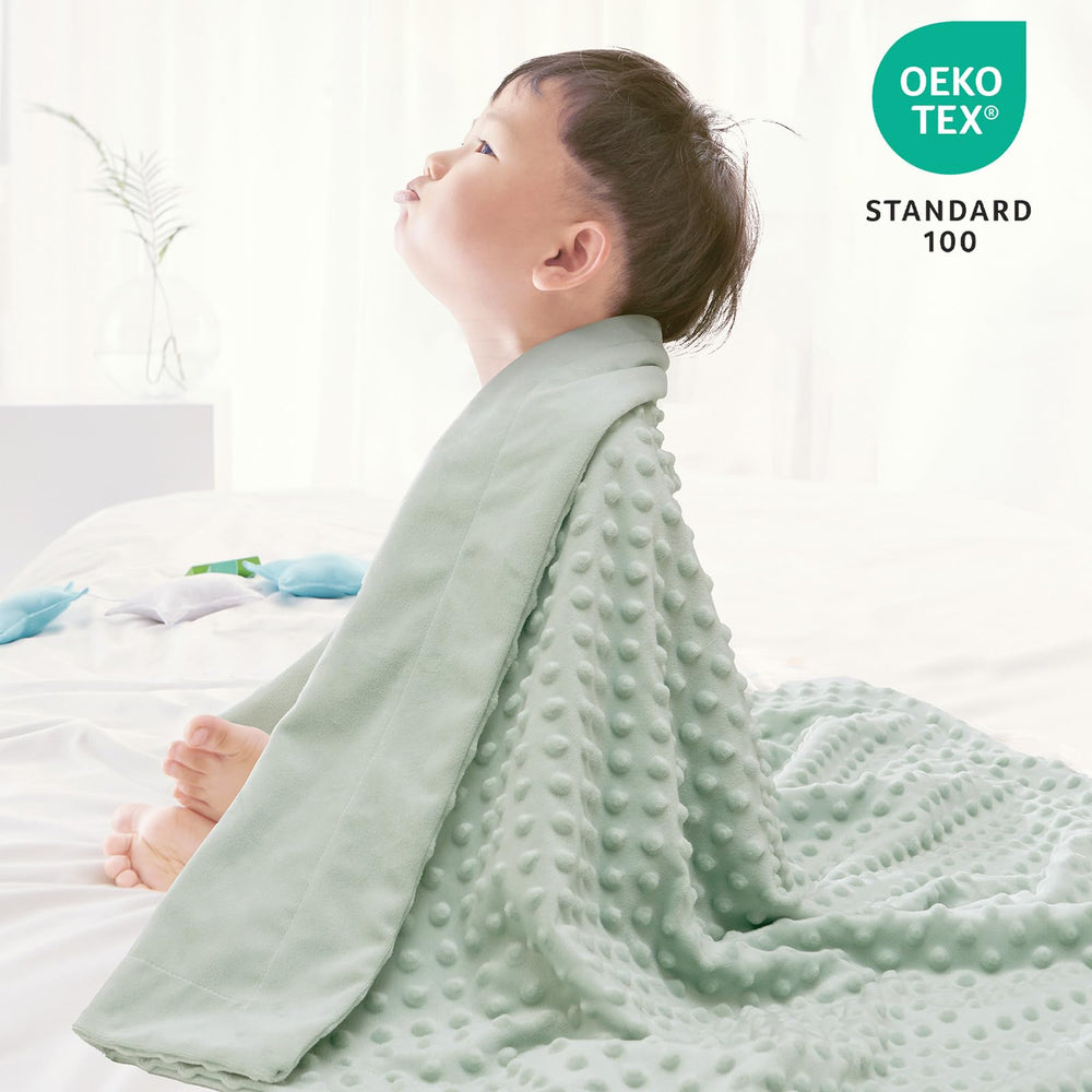 Raised dots close-up on David's Kids Minky blanket highlight tactile texture and engagement