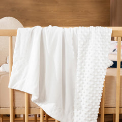 David's Kids Minky blanket in crib setting, breathable and lightweight for naps.