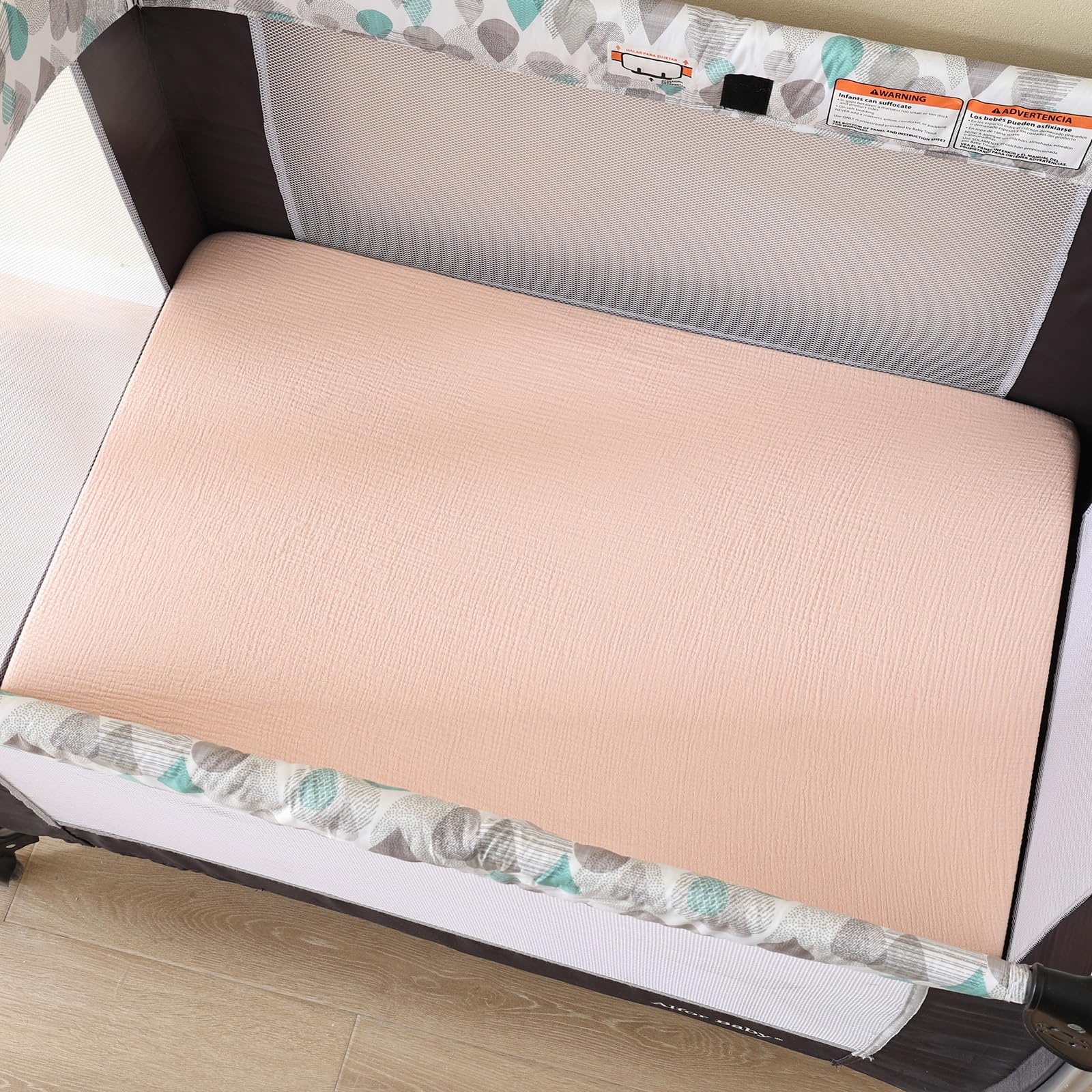 David's Kids muslin mini crib sheets with 360-degree elastic band, stays in place.