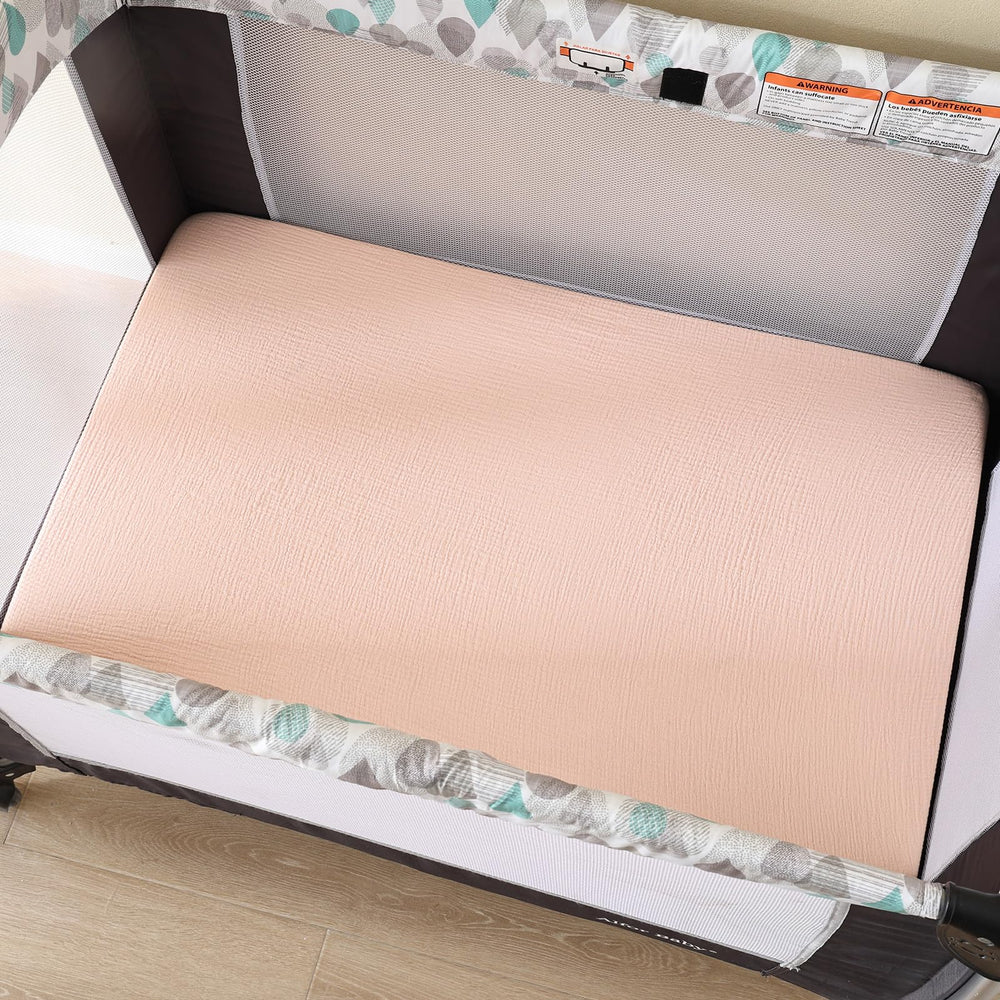 David's Kids muslin mini crib sheets with 360-degree elastic band, stays in place.