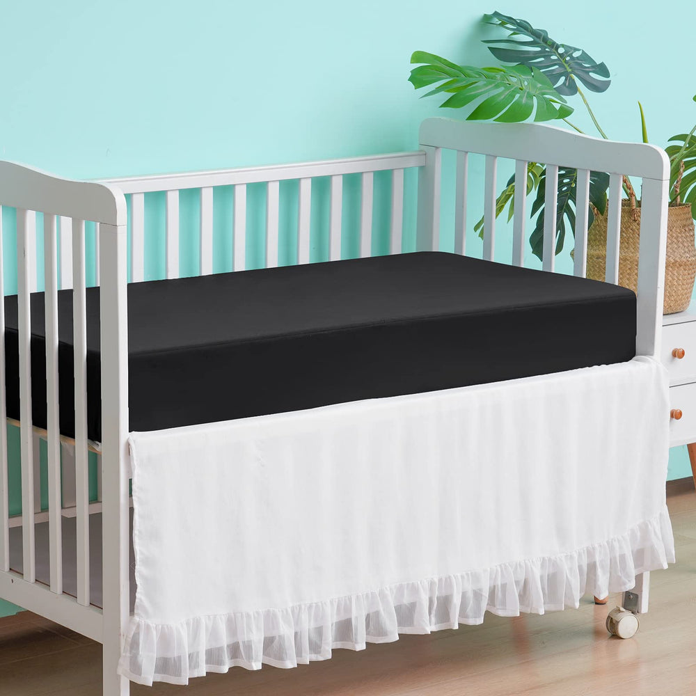 David's Kids waterproof crib sheets folded neatly for compact storage