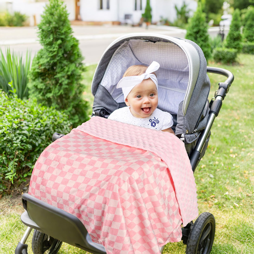 DAYEEBALL pink checkered blanket shown as nap time companion for toddlers and cuddly moments.