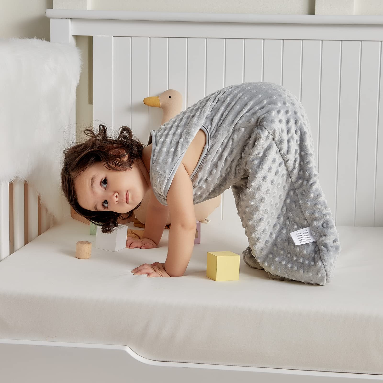 DaysU sleep sack shown in crib, stroller, or travel use.