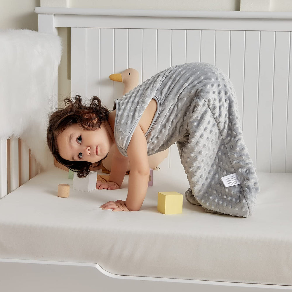 DaysU sleep sack shown in crib, stroller, or travel use.