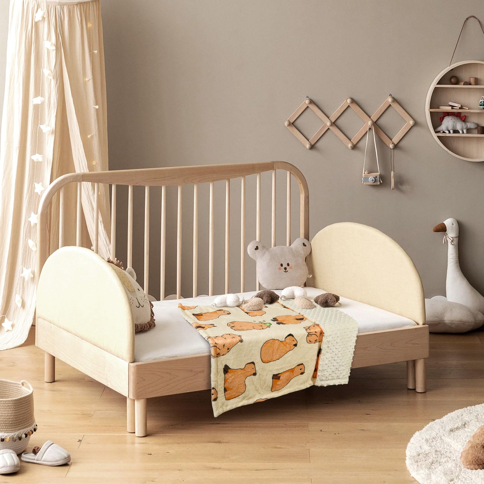DCOOLGO Capybara blanket used as photography prop for adorable baby portraits.