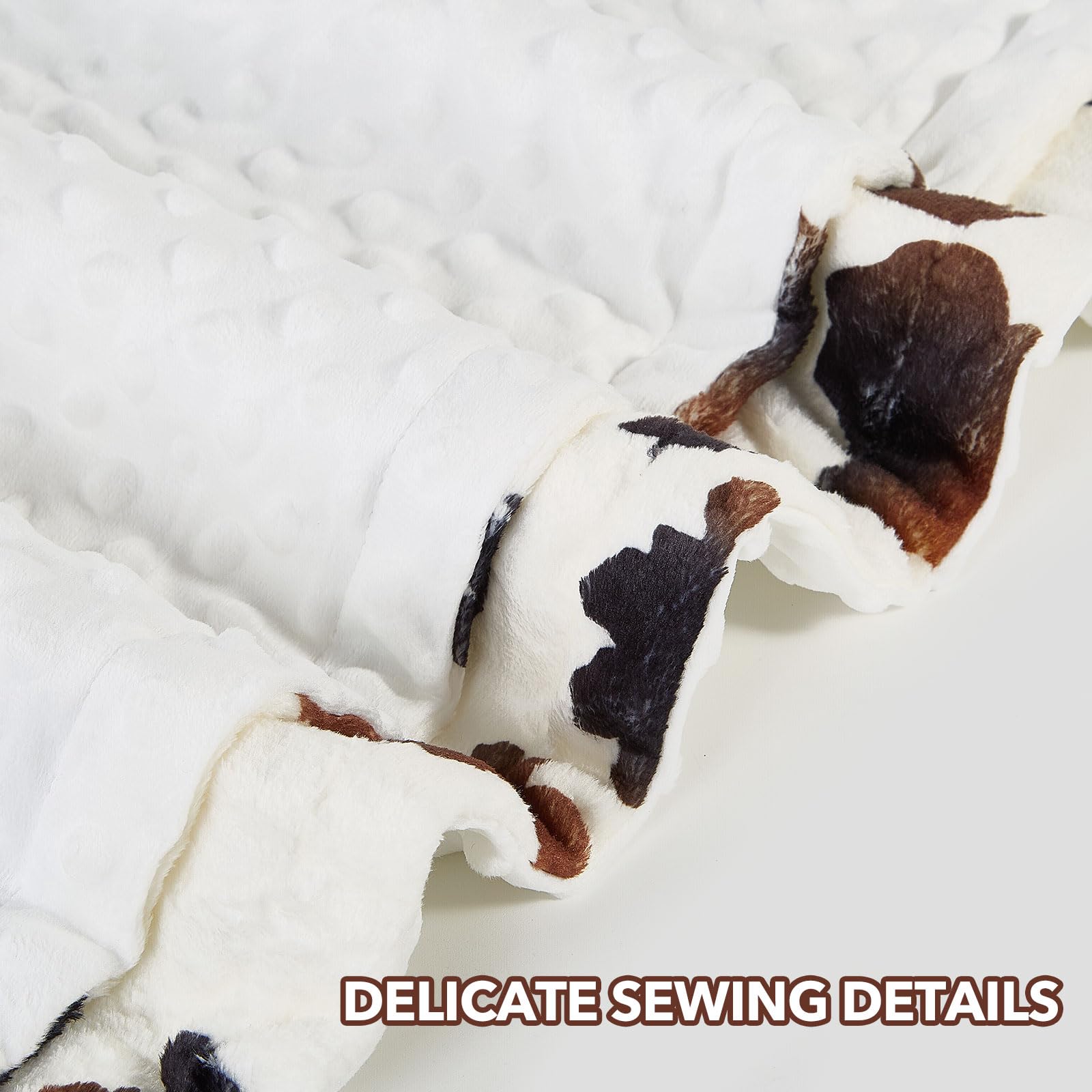 DCOOLGO cow baby blanket shown in a nursery setting highlighting plush softness.