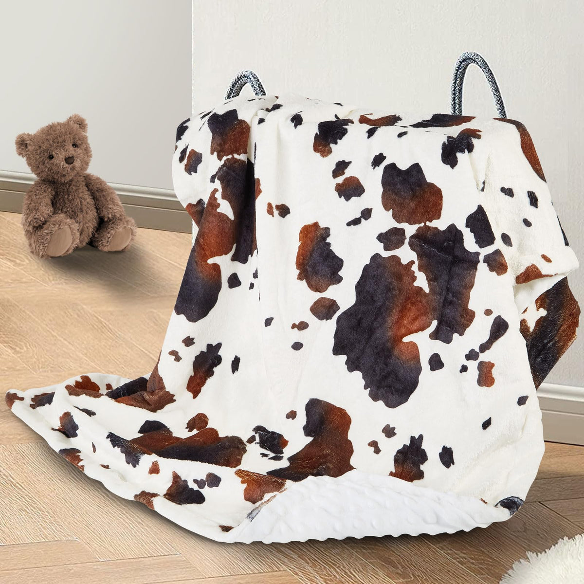 DCOOLGO cow baby blanket in soft fleece provides gentle cozy comfort.