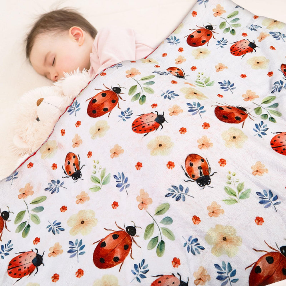 DCOOLGO Ladybug Blanket used as nursing cover for discreet feeding sessions.