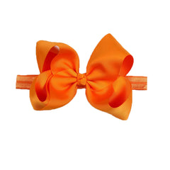 DDazzling baby large hair bow headband orange front view for cute photo moments