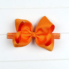 DDazzling baby large hair bow headband orange worn look for celebrations and family photos
