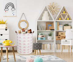 DDBASKET collapsible pink elephant hamper shown folded for space-saving storage.