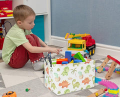 DDBASKET dinosaur basket in use for toy storage and organization.
