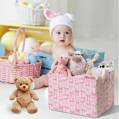 DEANHOT pink bow toy storage keeps nurseries tidy and inviting.