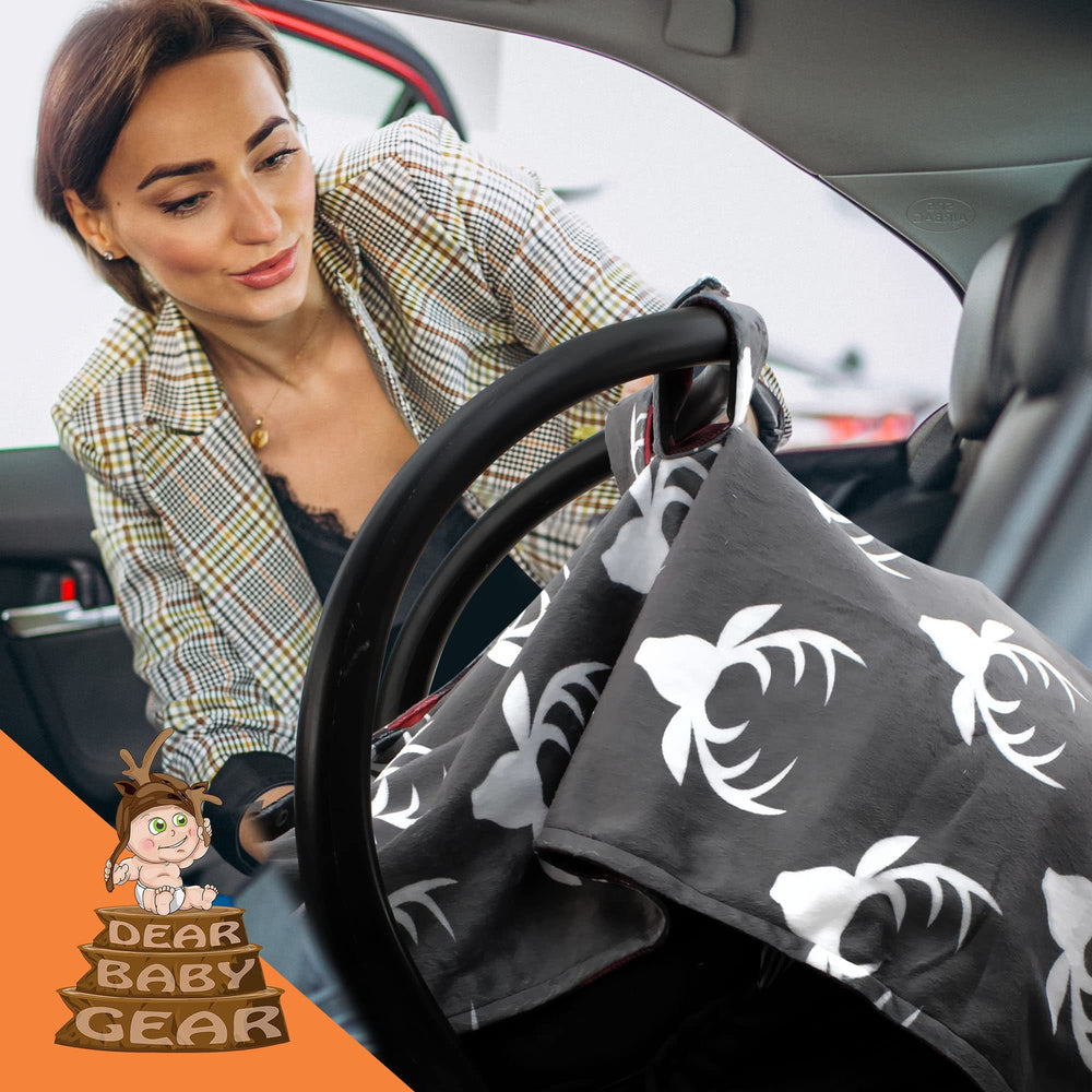 Dear Baby Gear infant carrier cover doubles as a nursing shield for hands-free feeding.