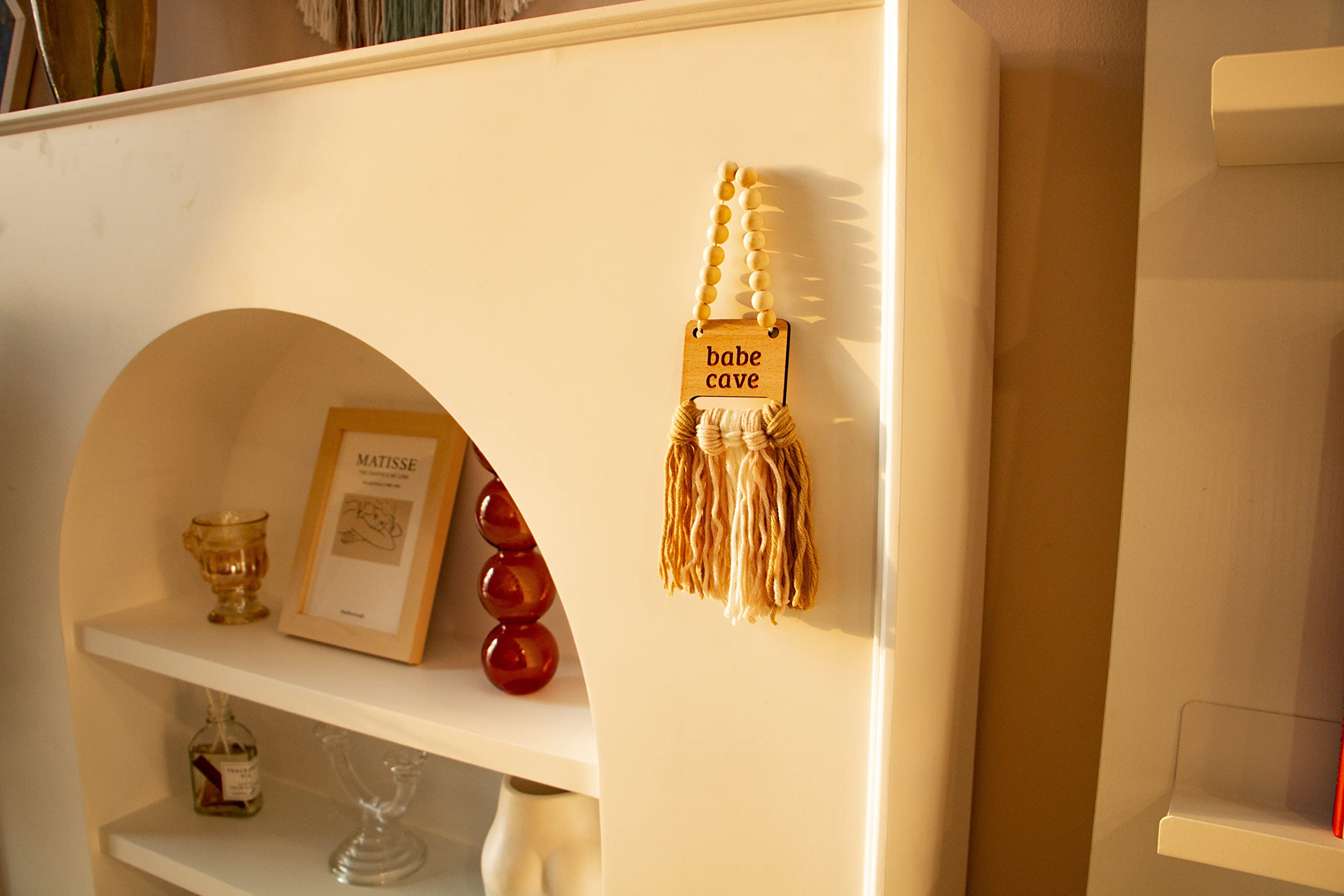 Decocove Babe Cave Sign hanging over crib creates a gentle focal point.