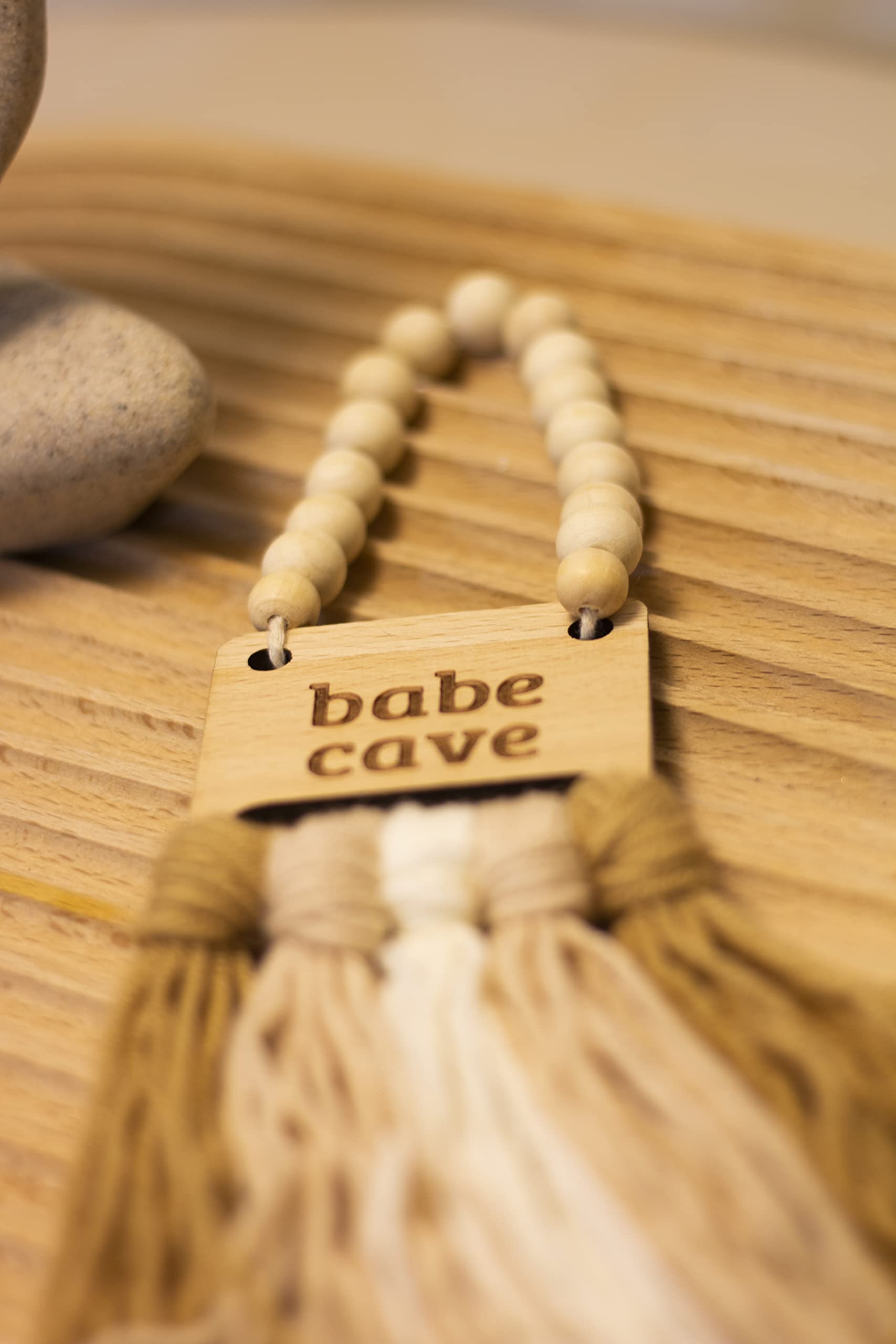 Decocove Babe Cave Sign door sign enhances playful bedroom entry.