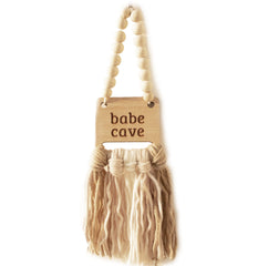 Decocove Babe Cave Sign wood bead garland adds cozy nursery style.