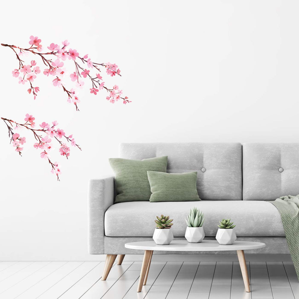DECOWALL DS6 watercolor cherry blossoms wall decals sprinkled across a nursery wall for a gentle, inviting look.