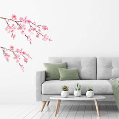 DECOWALL DS6 watercolor cherry blossoms wall decals sprinkled across a nursery wall for a gentle, inviting look.