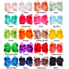 DED 8-inch grosgrain ribbon bows with sturdy alligator clips for secure wear.