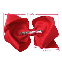 DED baby girl wearing large bow enhances daily outfits with charming flair.