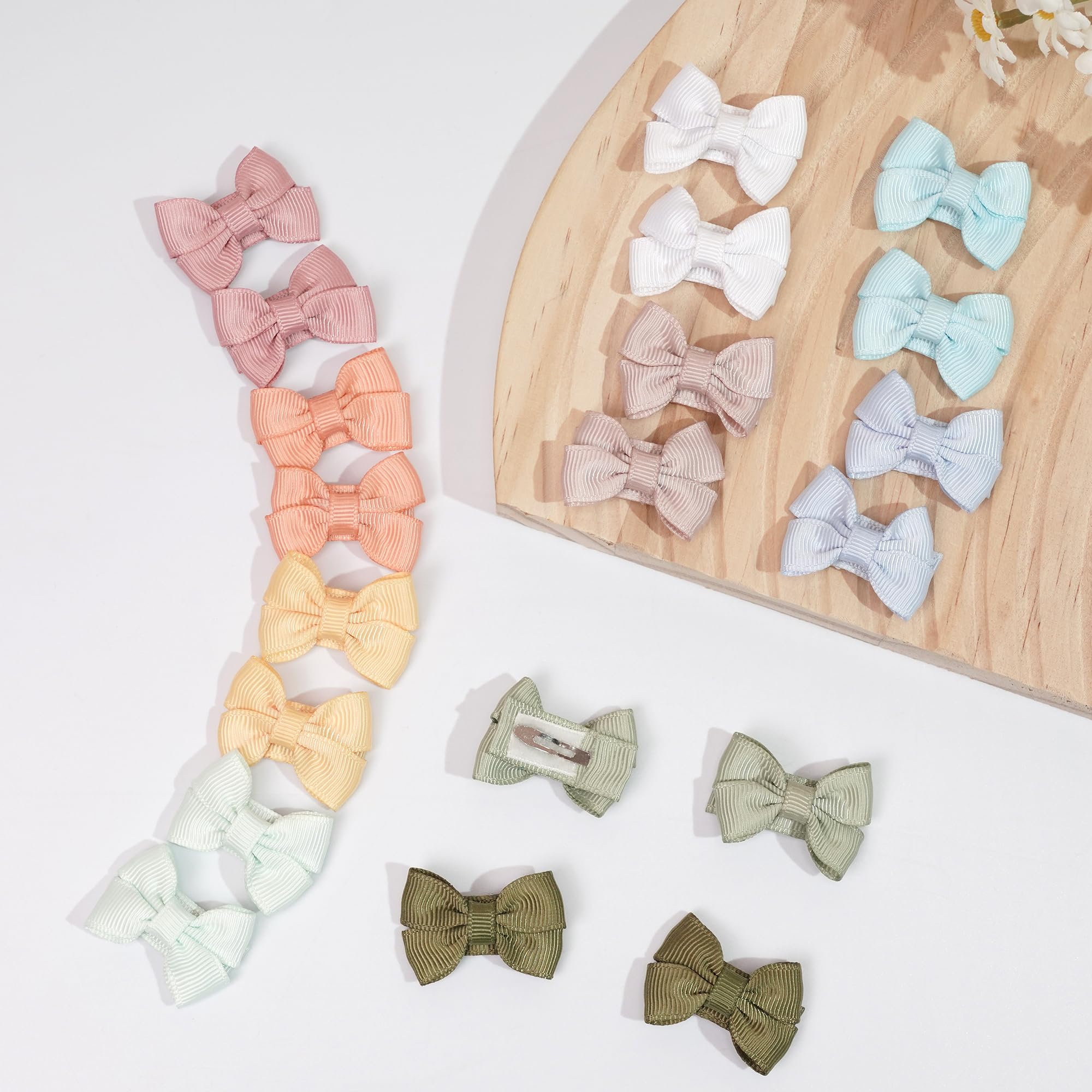 DED baby-hair-bows on head demonstrates gentle, face-framing accessory ideal for photos
