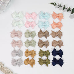 DED small bows styled for portrait sessions and gift-ready packaging