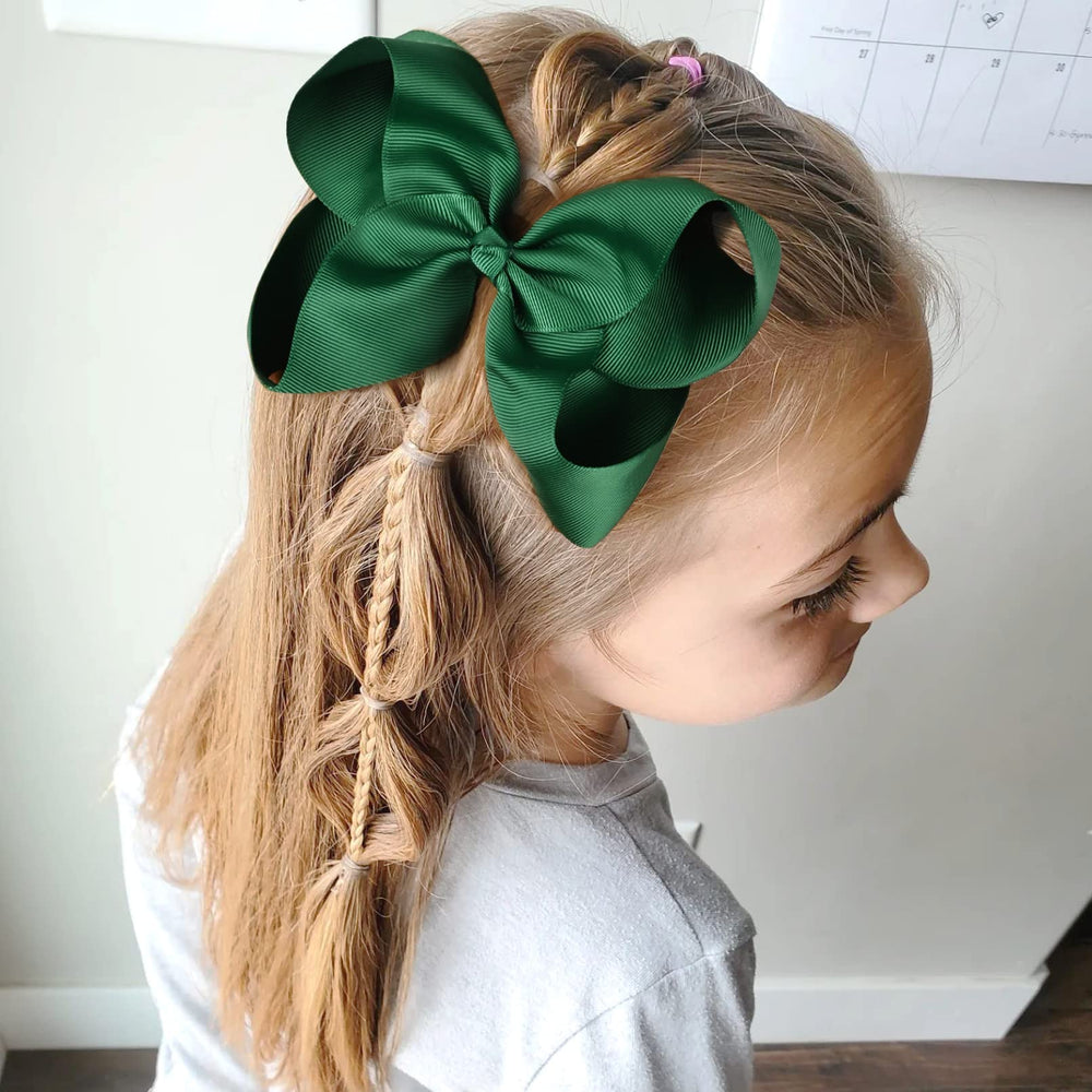 DEEKA alligator clip hair bow demonstrates sturdy attachment for busy mornings