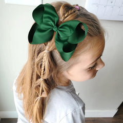 DEEKA alligator clip hair bow demonstrates sturdy attachment for busy mornings