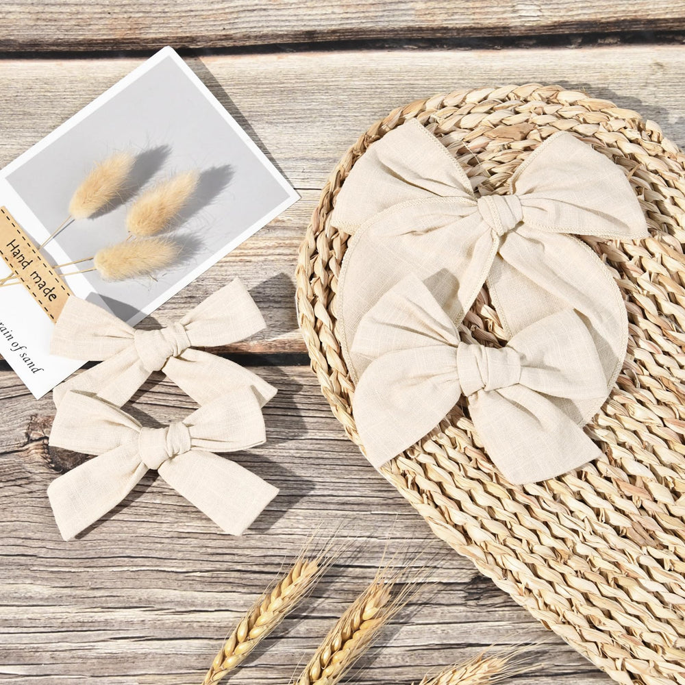 DEEKA beige knot bows in 4in for neat daytime wear