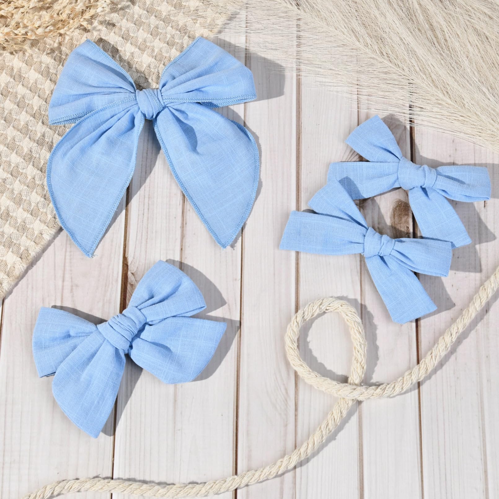 DEEKA blue bow set packaging highlights four-piece collection for versatile styling