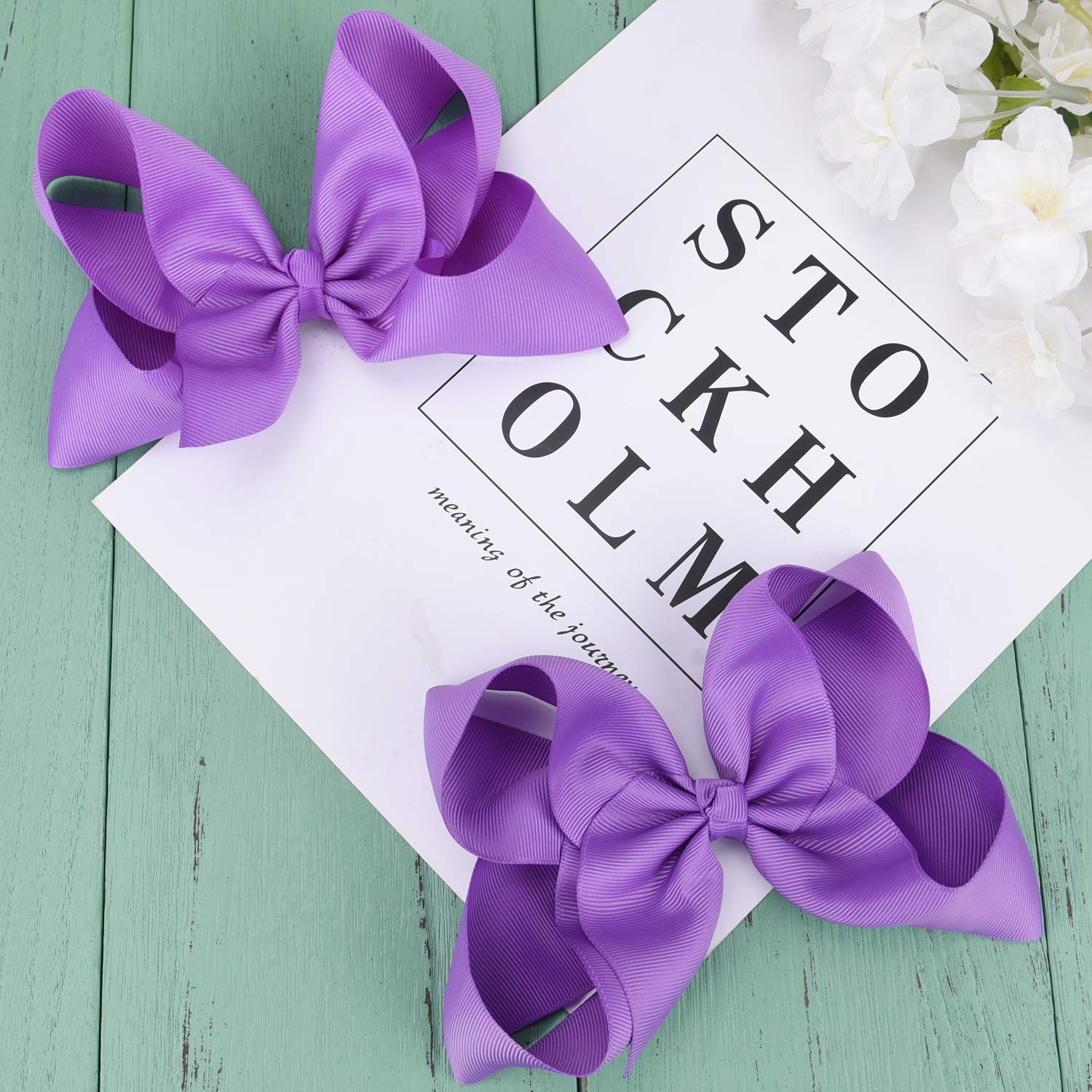 DEEKA clip detail purple shows secure attachment for teen and toddler hair.