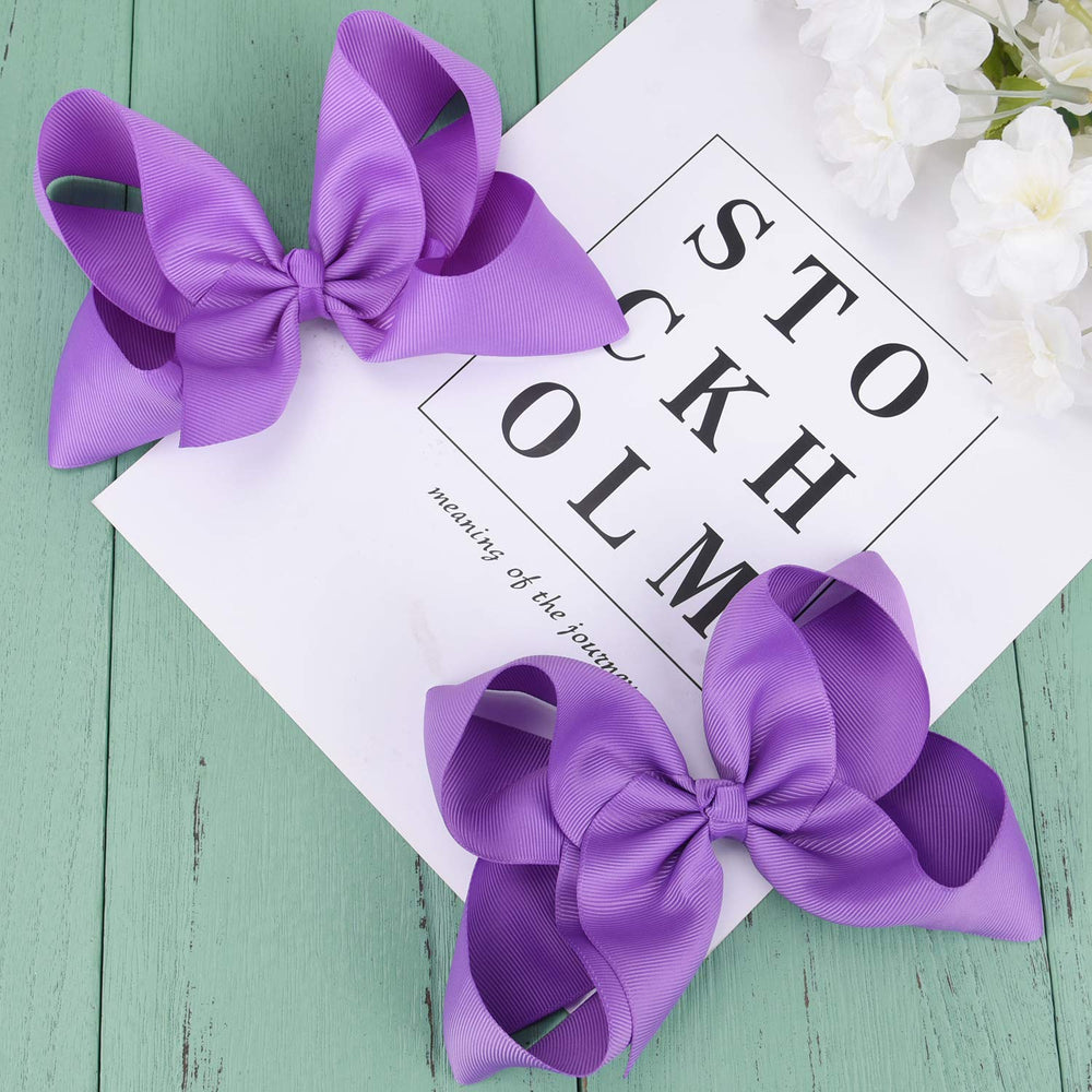 DEEKA clip detail purple shows secure attachment for teen and toddler hair.