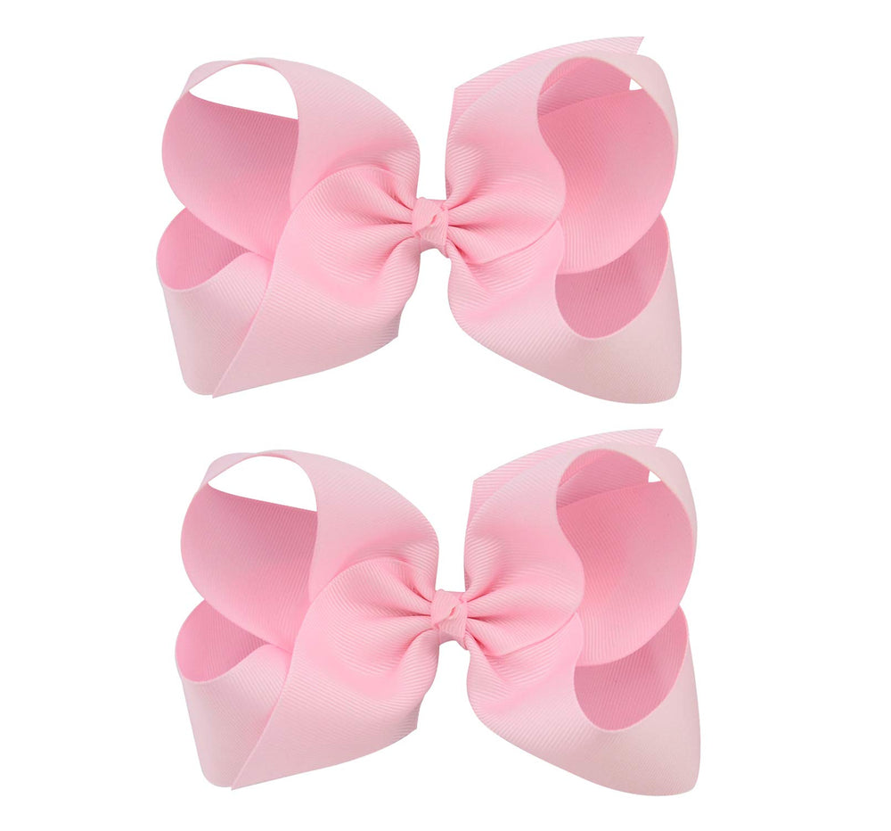DEEKA gift-ready two-bow set in light pink for birthdays or school photos.