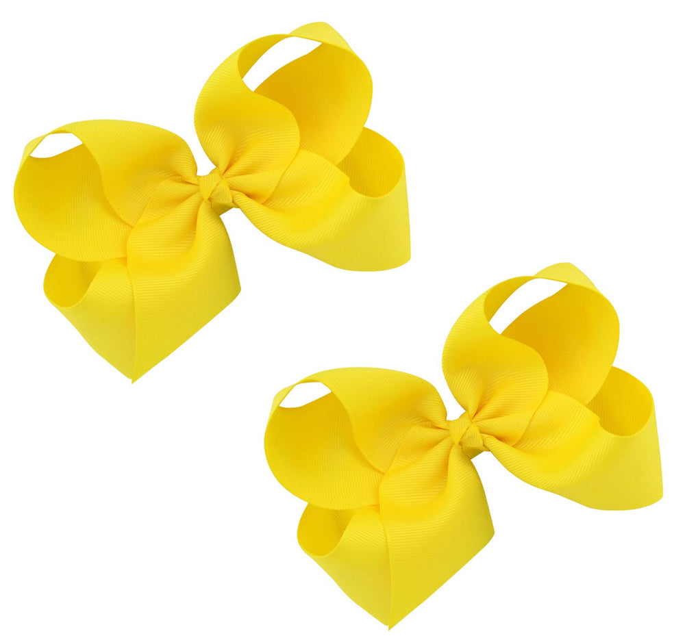 DEEKA yellow bow on dress demonstrates outfit compatibility