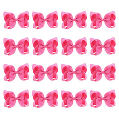 DEEKA hot pink 4-inch hair bow on a clip for quick outfits.