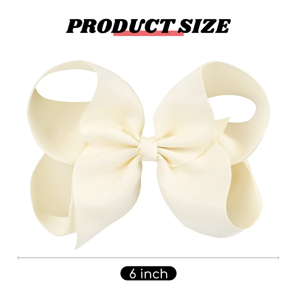 DEEKA ivory solid-color hair bow closeup highlighting clip and ribbon.