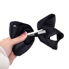 DEEKA large hair bow closeup demonstrates easy styling for back-to-school looks.