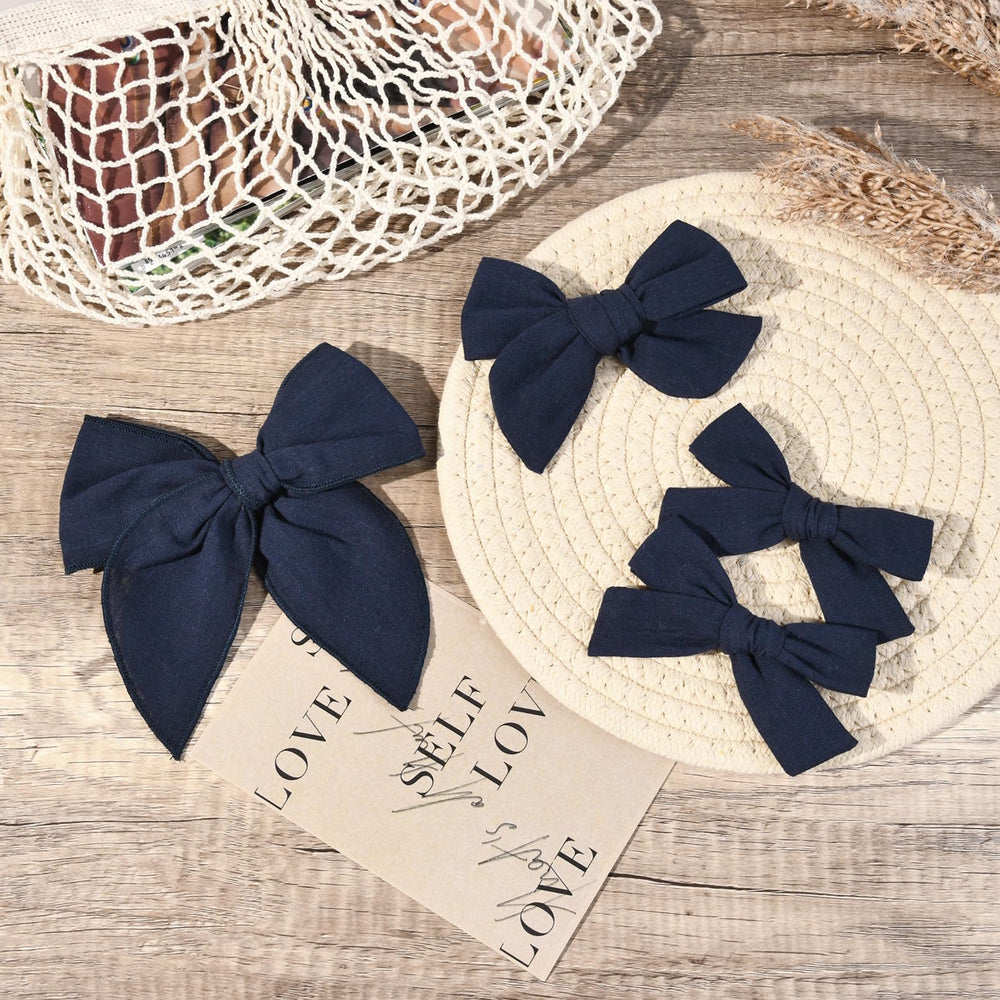DEEKA navy blue 4-inch knot bow with clip, ideal for small ponytails and buns