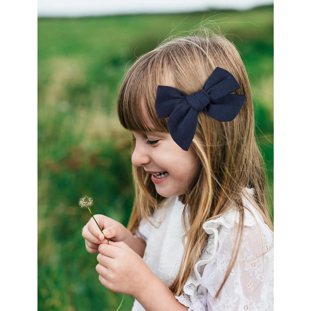 DEEKA navy blue bow complements half-up-do hairstyles for cute daily outfits
