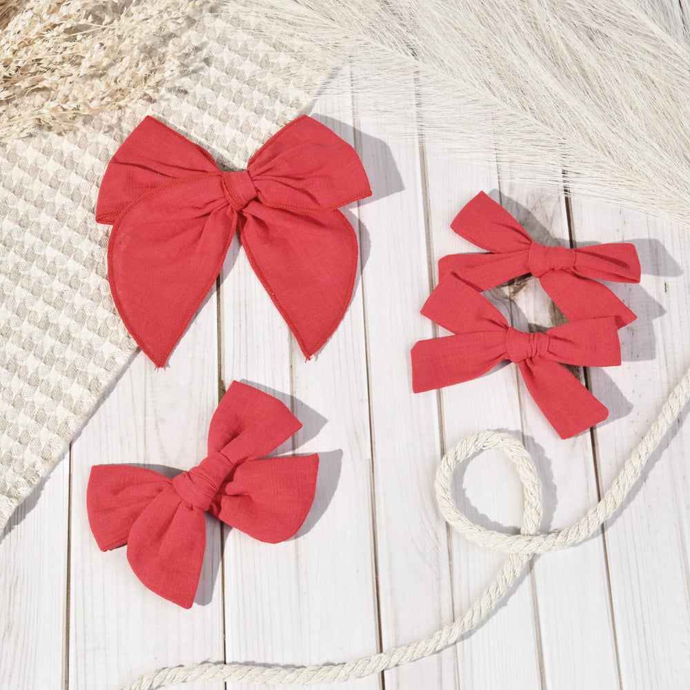 DEEKA red bows paired with school uniform for polished everyday look